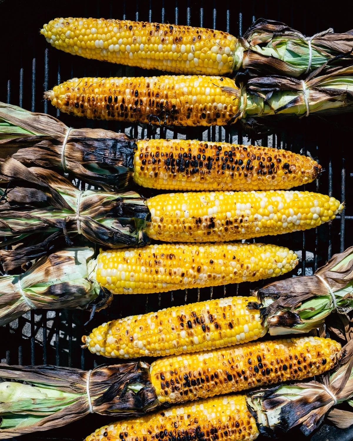 Corn on the cob grilling on outdoor grill