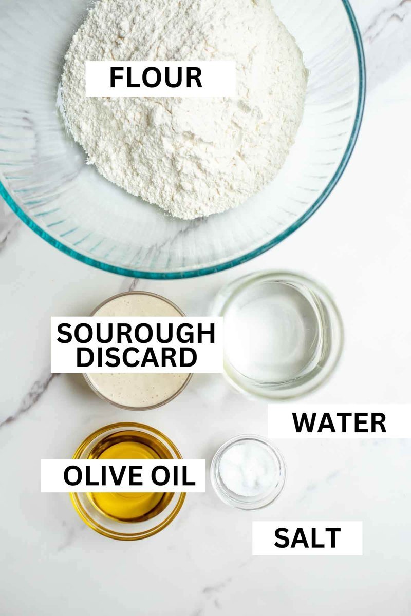 Flour, salt and sourdough starter lined up on counter