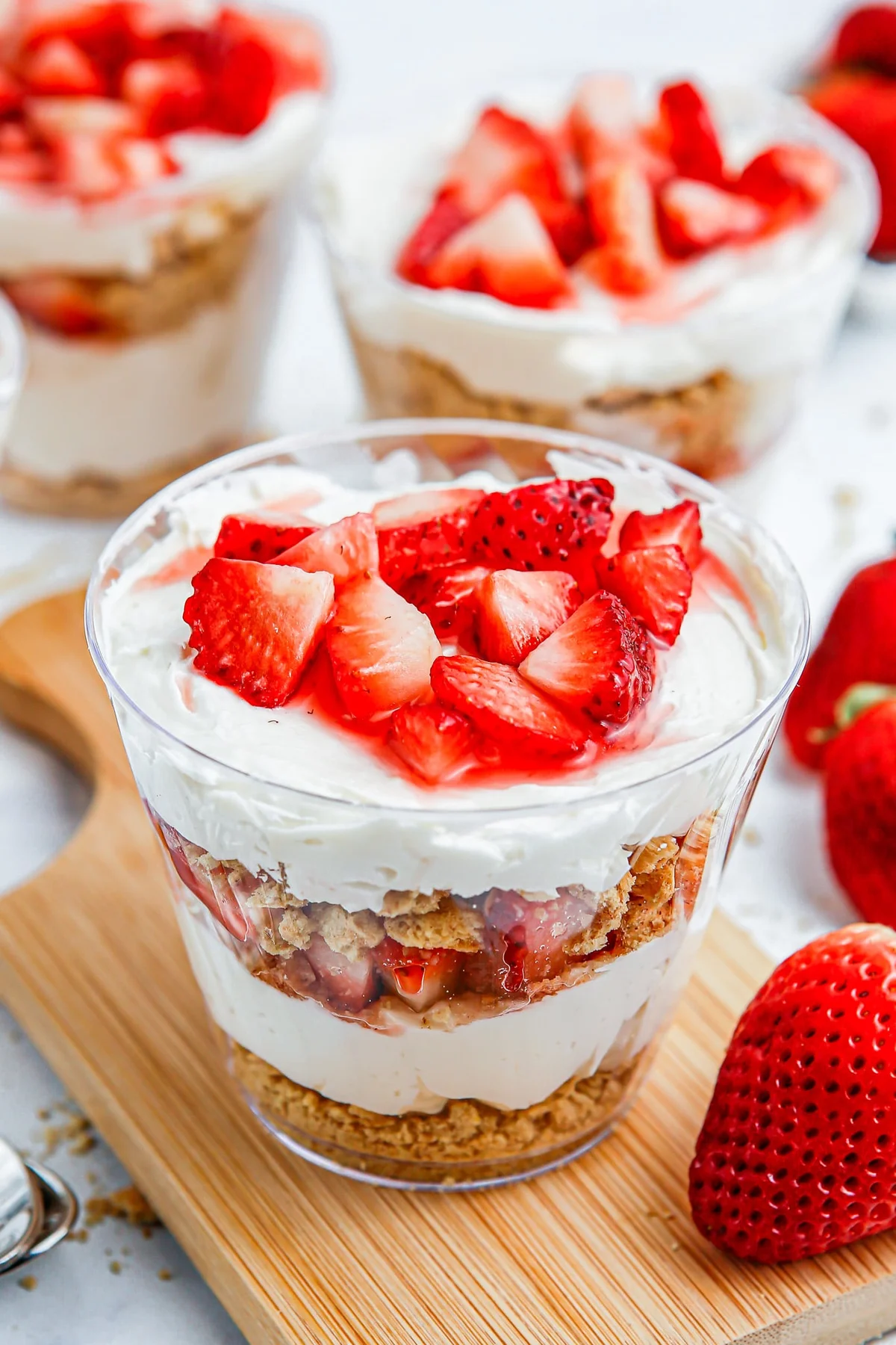 Strawberry cheesecake parfait cups with fresh strawberries
