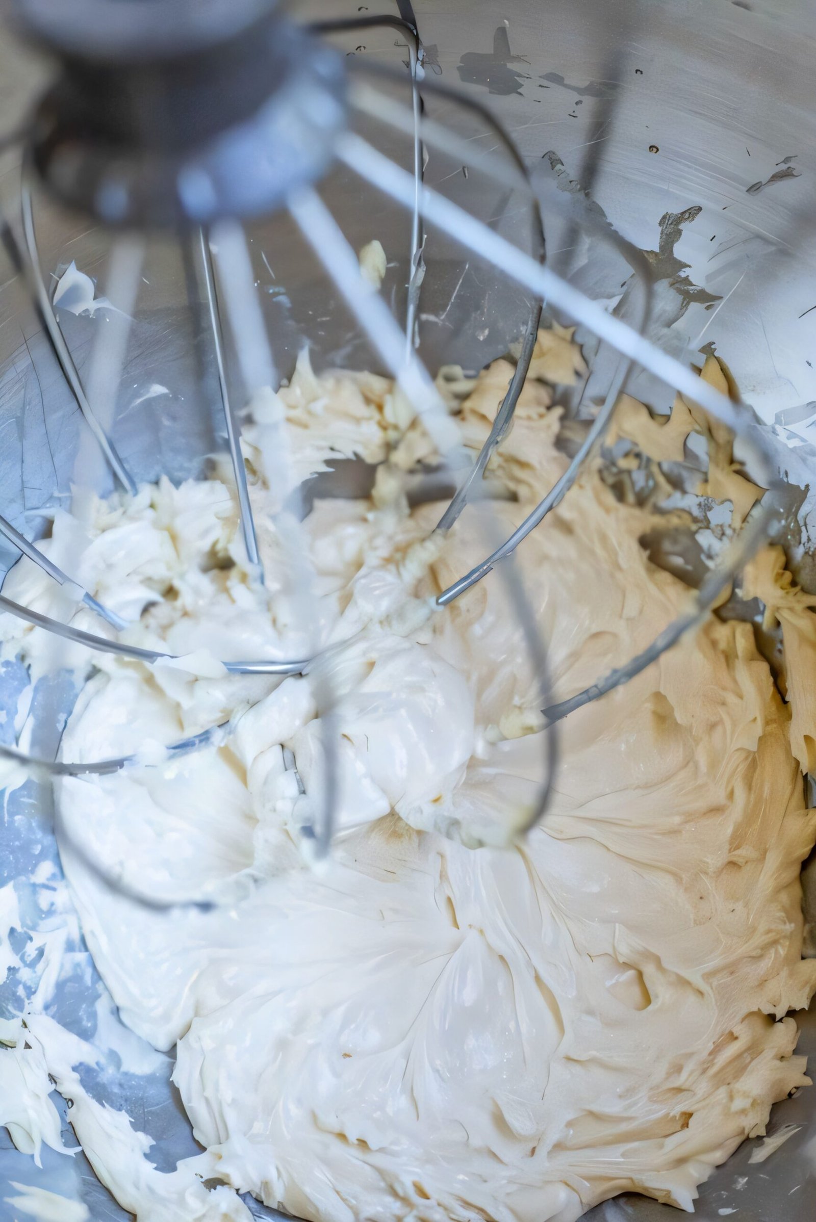 Stand mixer whipping butter and maple syrup together