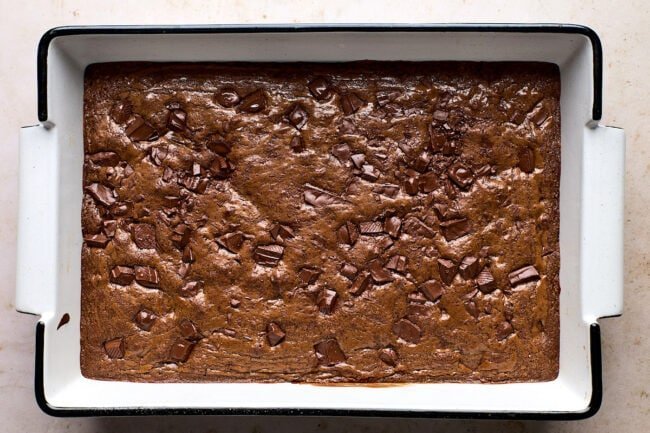 Sliced brownie cake with caramel drizzle and crushed toffee