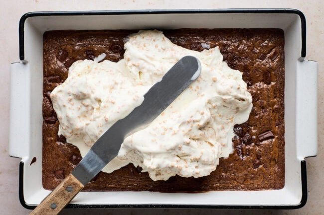 Fudgy brownie batter with chocolate chunks in a 9x13 pan