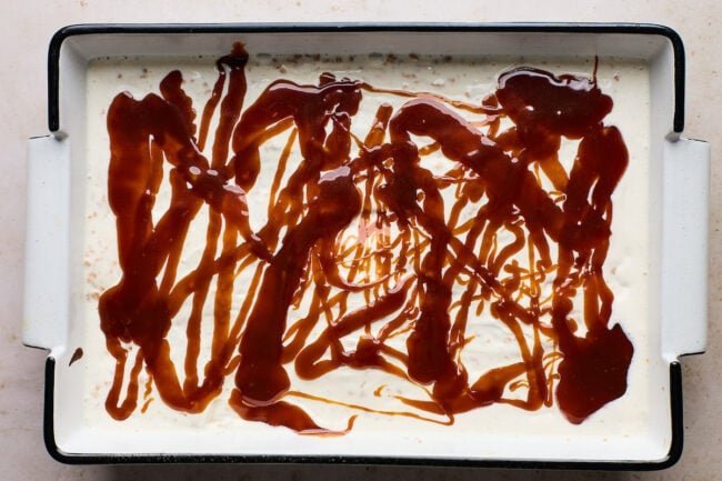 Tofee-laced vanilla ice cream spread over cooled brownies