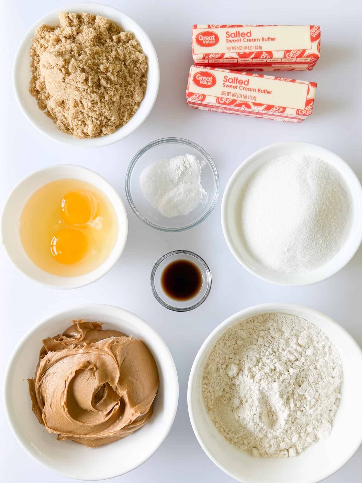 Cookie ingredients measured and arranged in bowls on a counter