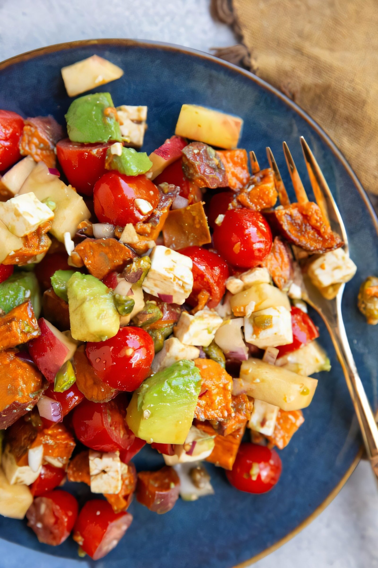 Roasted sweet potato and apple salad tossed with balsamic dressing overhead
