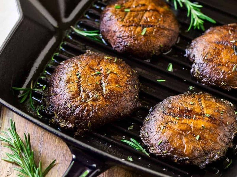 Grilled portobello mushrooms with savory charred surfaces