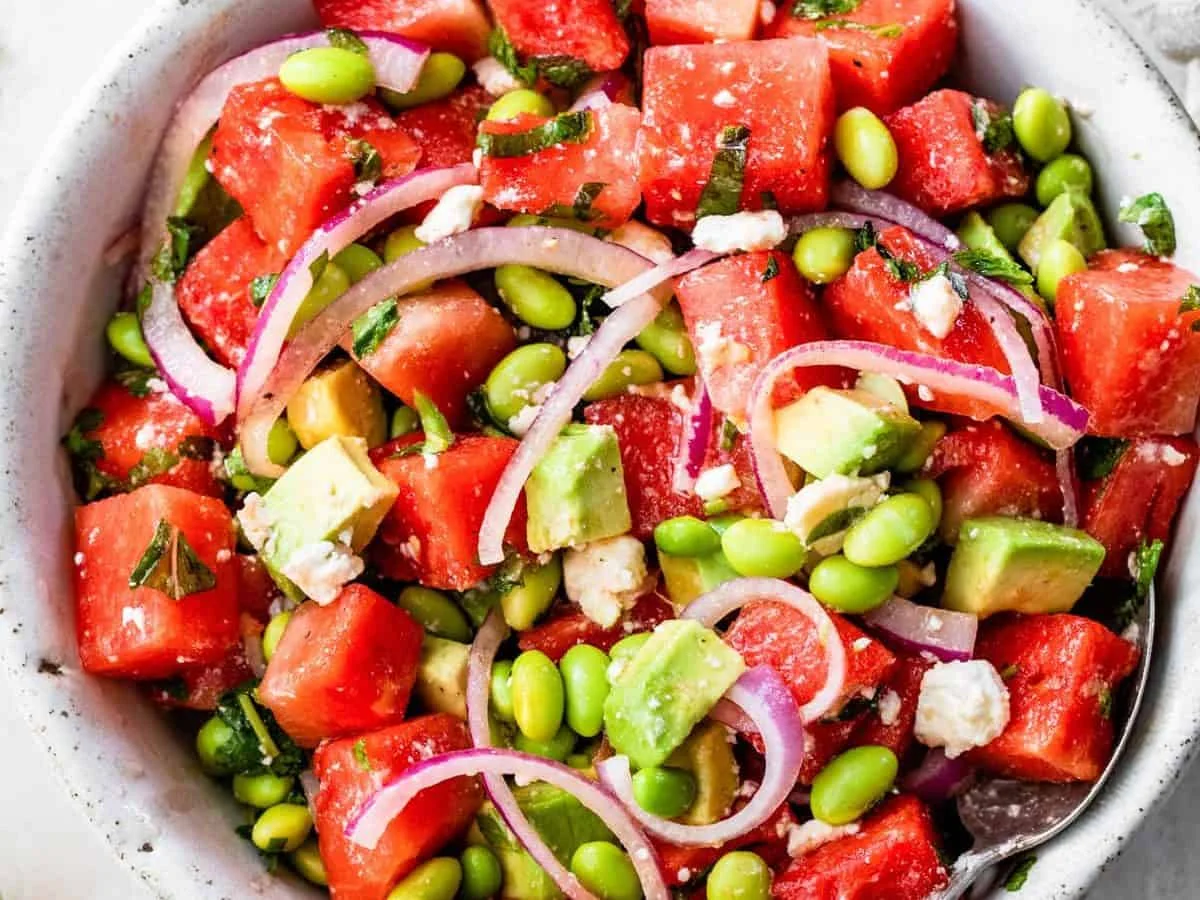 Watermelon and feta salad with avocado in a bowl