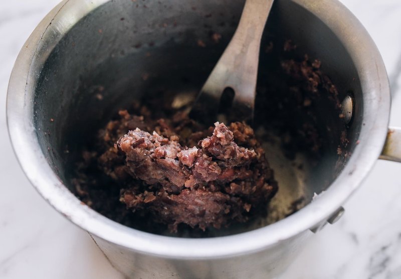Thick creamy red bean paste close-up in a pot